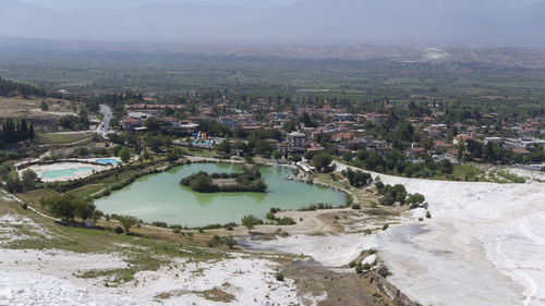 High angle view of river amidst buildings in city