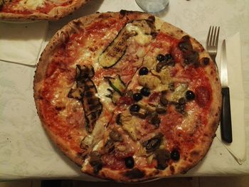 High angle view of pizza in plate on table