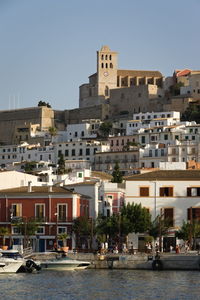 View of buildings in town against sky