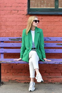 Young woman sitting on bench