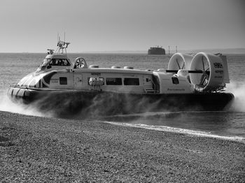 View of ship on beach against sky