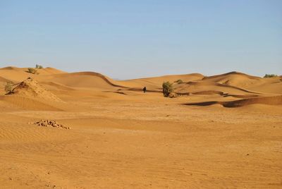 Scenic view of desert against clear sky