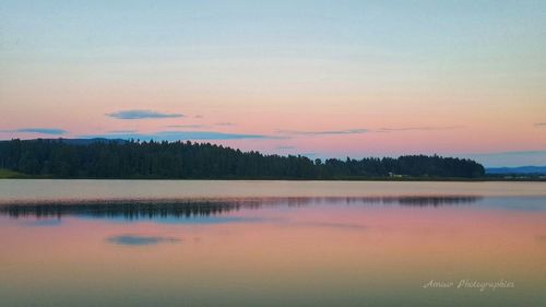 Scenic view of lake at sunset