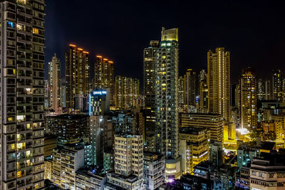 High angle view of city lit up at night