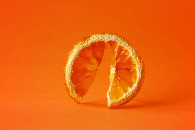 Close-up of orange over white background