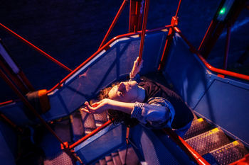 BOY LYING DOWN IN A ROW