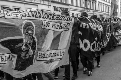 People with banners during protest on street