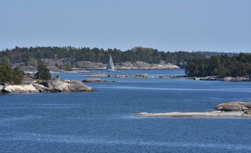 Scenic view of sea against clear blue sky