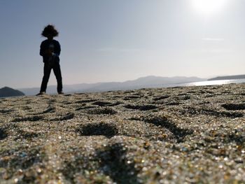 Full length of man standing on land against sky