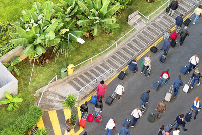 High angle view of people walking on road