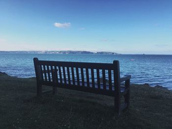 Scenic view of calm sea against cloudy sky