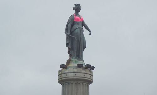 Low angle view of statue against the sky