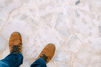 Low section of man standing on floor