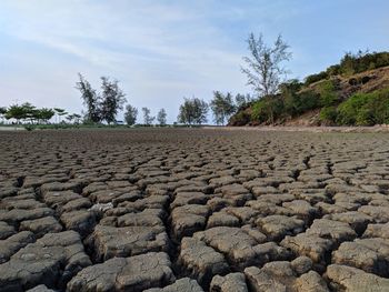 View of rocks on land against sky