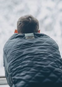 Rear view of man on snow