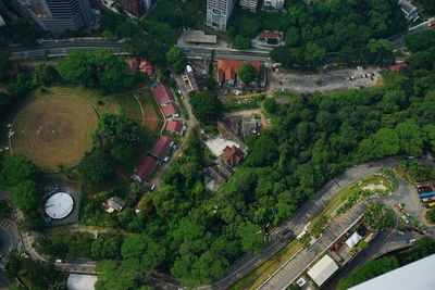 Aerial view of men base jumping over city