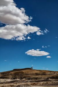 Scenic view of hill against sky