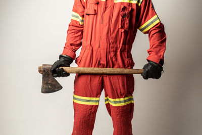 Low section of person standing against white background