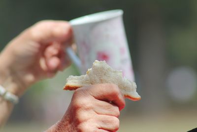Close-up of hand holding ice cream