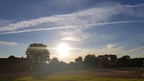 Scenic view of field against sky during sunset