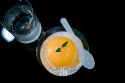 High angle view of breakfast on table against black background