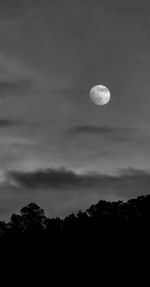 Low angle view of moon against sky at night