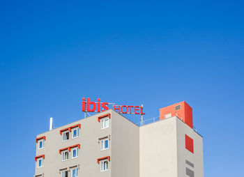 Low angle view of building against blue sky