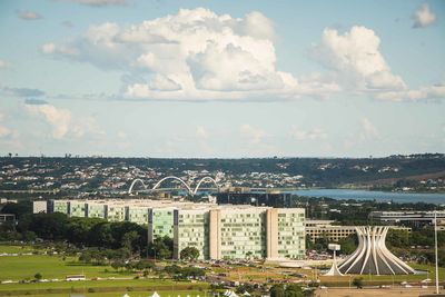 High angle view of buildings in city against sky