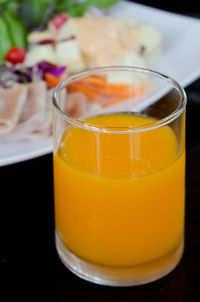 Close-up of orange juice in glass