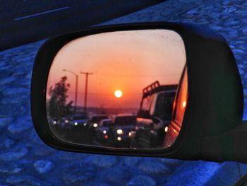 Reflection of car on side-view mirror