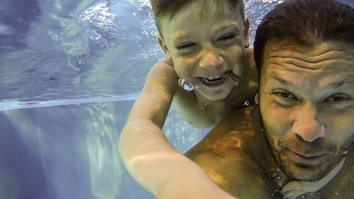 Portrait of smiling man in swimming pool