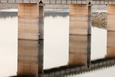 Reflection of bridge on building