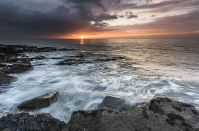 Scenic view of sea against sky during sunset