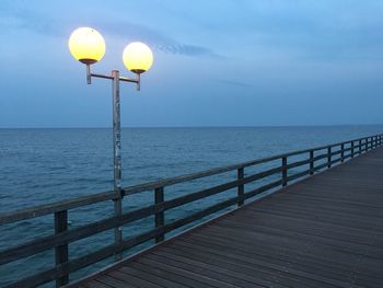 Scenic view of pier over sea against sky