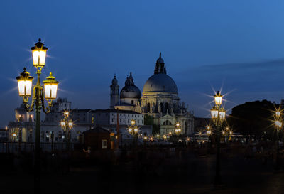 Illuminated cathedral against sky at night