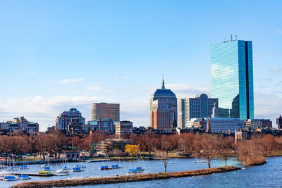 Buildings in city against sky