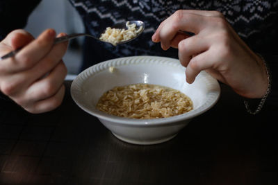 Midsection of person preparing food