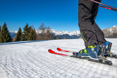 Person skiing on snow in mountains