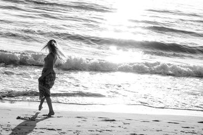 Woman standing on beach