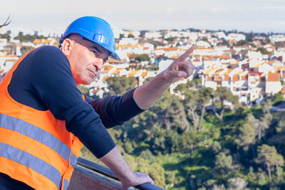 Rear view of man standing against sky