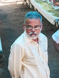 High angle view of man looking away while standing outdoors