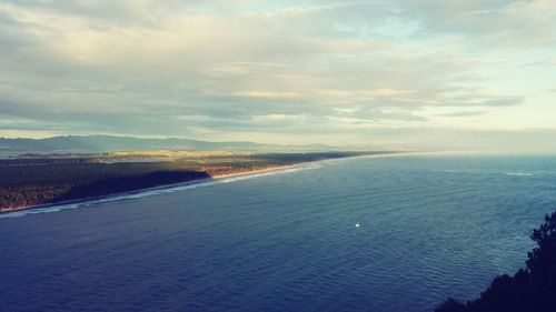 Scenic view of landscape against cloudy sky