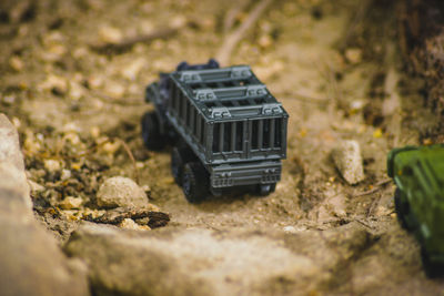 Close-up of toy car on rock