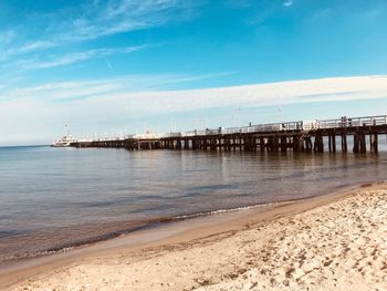 Pier over sea against sky