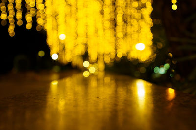 Defocused image of illuminated lights at night