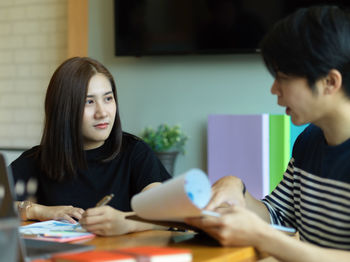 Business people discussing on table in office