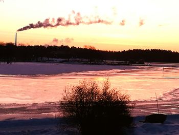 Scenic view of silhouette landscape against sky at sunset