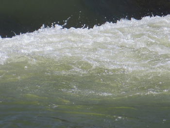 High angle view of water flowing in sea