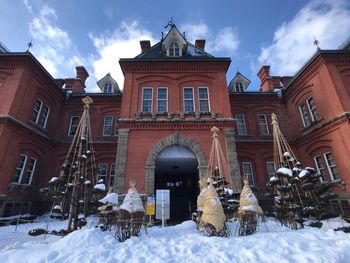 Low angle view of historic building against sky during winter