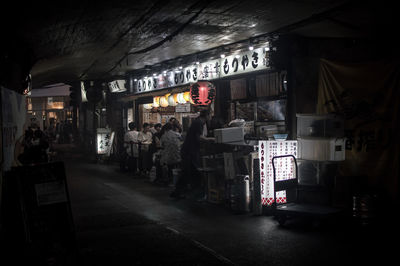 Information sign in market at night